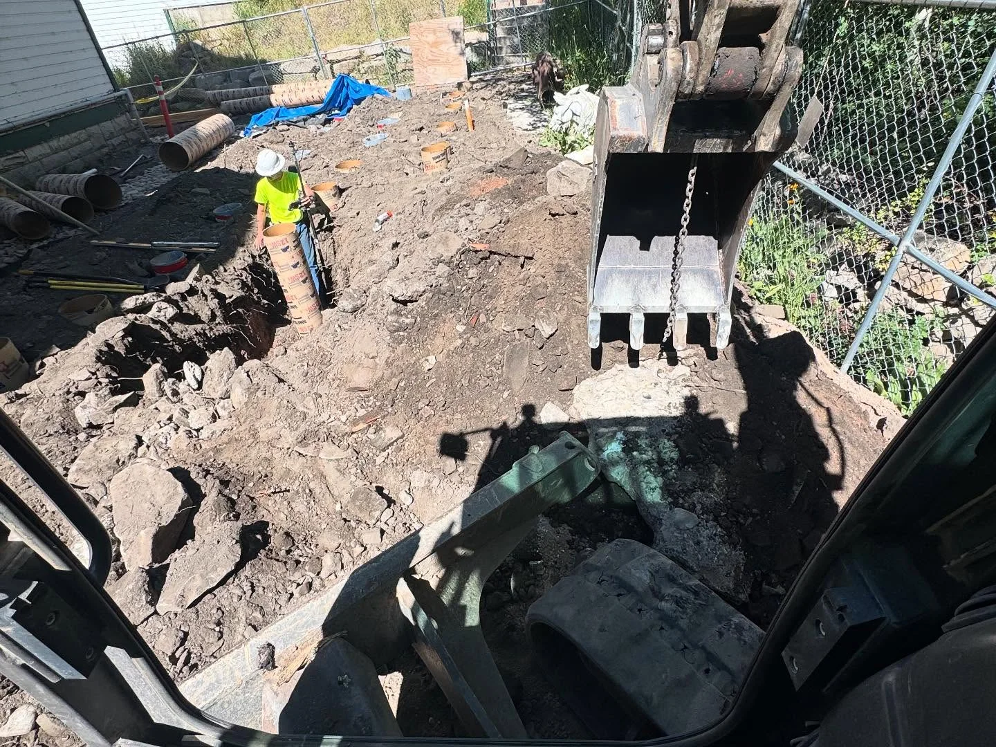 Crew and excavator working on a residential property